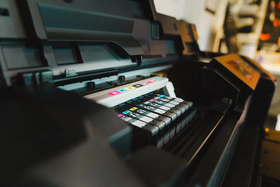PLS Printer technician with diagnostic tools in a small business office